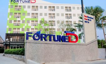"a large building with a sign that reads "" fortune "" prominently displayed on the side of the building" at Fortune D Hotel Loei