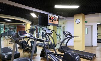 A spacious room in the center is equipped with treadmills and exercise equipment for everyone at Sunworld Hotel