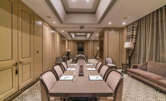 There is a spacious room with long tables and chairs available for meetings or other business purposes at IFC Residence