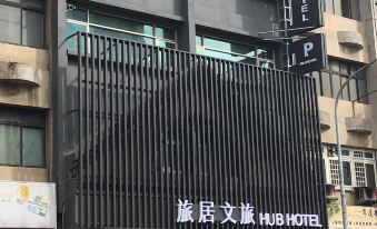 "a building with a black and white sign that reads "" hub hotel "" prominently displayed on the front" at Hub Hotel