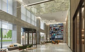 The lobby is designed to resemble a spacious building, complete with floors, ceiling windows, and an elegant ambiance at Hilton Garden Inn Shanghai Hongqiao NECC