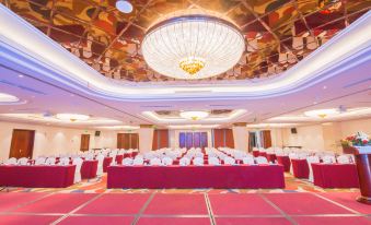 The hotel has a ballroom equipped with tables and chairs for hosting events or functions at Longyou International Grand Hotel
