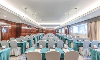 A spacious room is arranged with tables and chairs for an event at the hotel or conference at Sorl Bund Hotel Ruian
