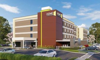 "a rendering of a large building with the words "" home 2 hotel "" prominently displayed on it" at Home2 Suites by Hilton Hagerstown