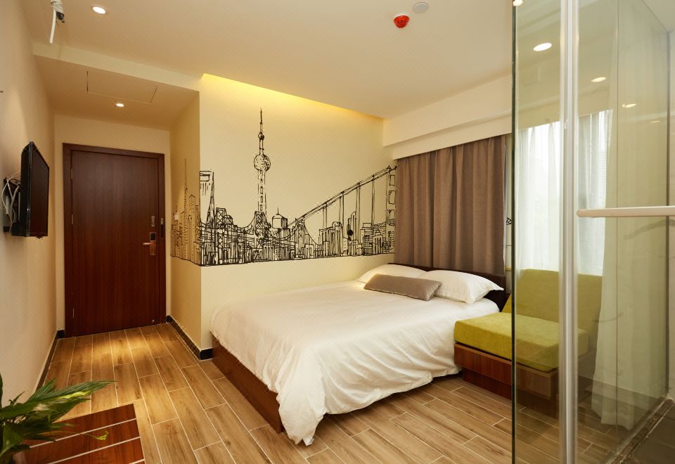The apartment or bedroom features a spacious bed and a city view at Meego Qingwen Hotel