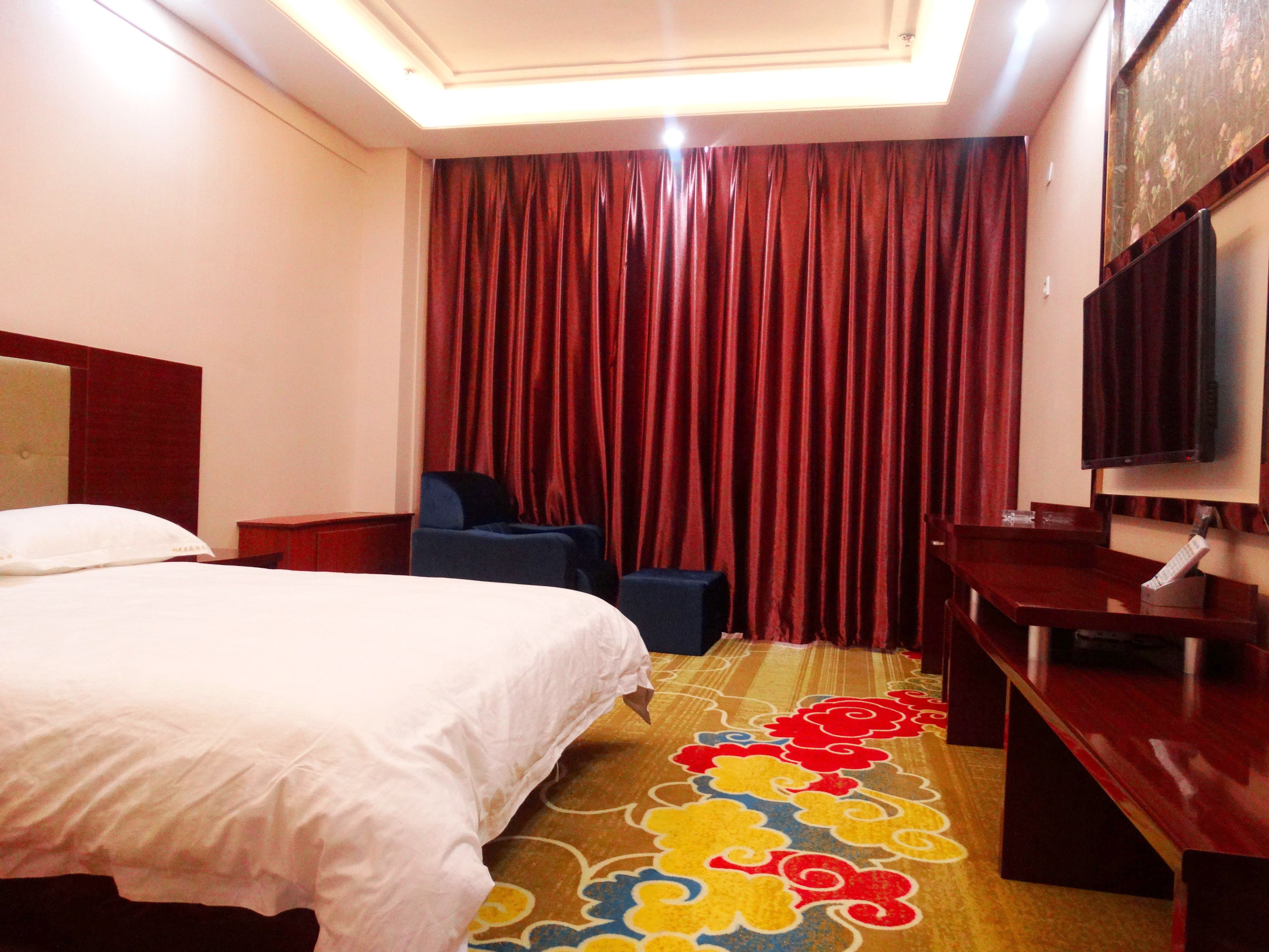Mulei Sunshine Flower Garden HotelKing-size bed room