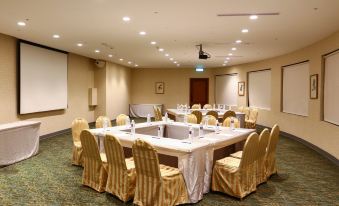 a conference room set up for a meeting , with several chairs arranged in a circle around a table at Hotel Cham Cham - Taipei