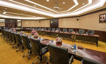 The conference room is spacious and equipped with long tables and chairs, suitable for meetings and social functions at Parsian Azadi Hotel