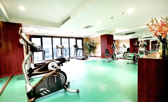 A spacious room with multiple exercise equipment and a central indoor fitness center is also available at Ramada by Wyndham Beijing Airport