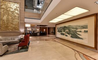 The room features a spacious layout with art deco designs on the walls and floor-to-ceiling windows at Hotel Equatorial Shanghai