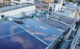 a rooftop with a large glass skylight , allowing natural light to fill the space for relaxation and observation at Hotel Metropolitano