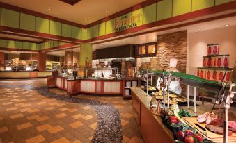 a buffet - style restaurant with a variety of food options , including fruits , vegetables , and desserts at Mount Airy Casino Resort - Adults Only