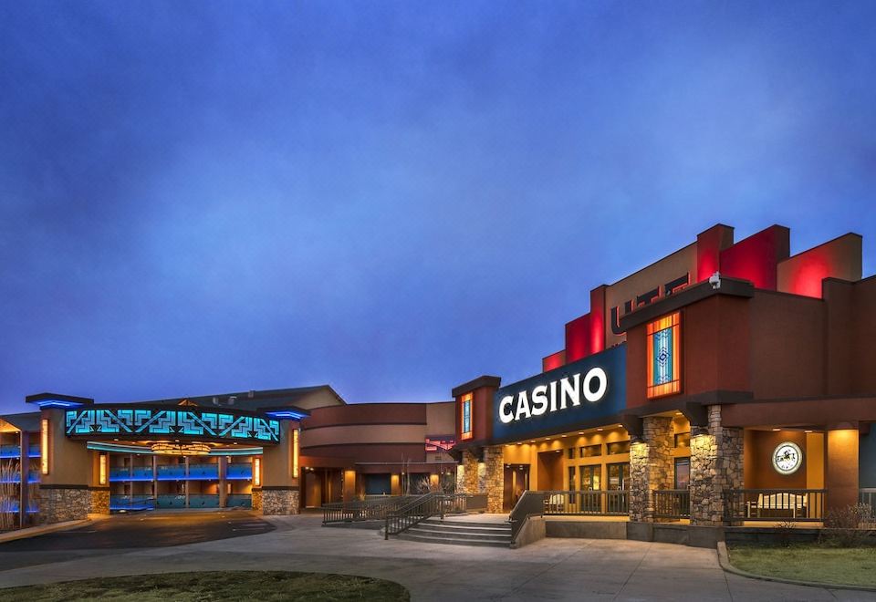 "a large casino building with a sign that reads "" casino "" prominently displayed on the front of the building" at Ute Mountain Casino Hotel