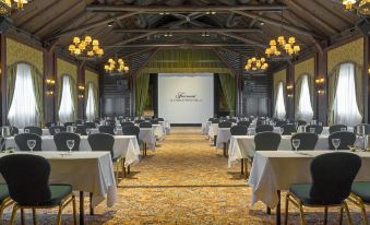 a large conference room with rows of tables and chairs arranged for a meeting or event at Fairmont le Chateau Montebello