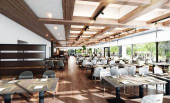 a modern restaurant with wooden floors and tables , surrounded by windows that provide natural light at Izu Marriott Hotel Shuzenji