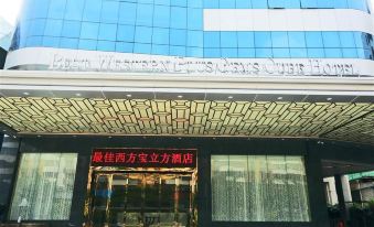 The front entrance of a hotel is adorned with an oriental sign, while other buildings surround it at Gems Cube International Hotel