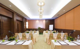 a well - organized conference room with multiple tables and chairs , ready for a meeting or event at Pimalai Resort & Spa