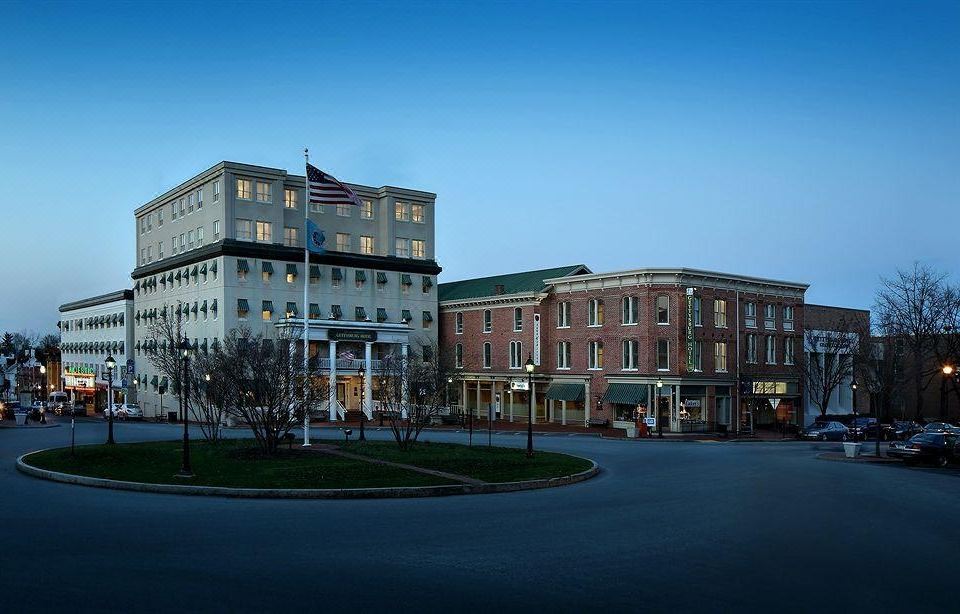 two buildings with the american flag on top , one of which has a flag flying at Gettysburg Hotel