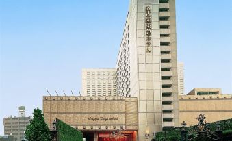 "a large building with a modern design and the name "" kowloon walled city "" on top" at Nagoya Tokyu Hotel