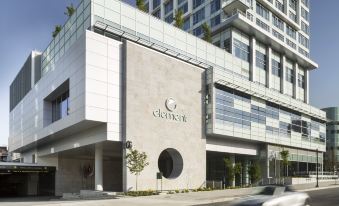 "a modern office building with a sign that reads "" omni "" on the side of a building" at Element Vancouver Metrotown