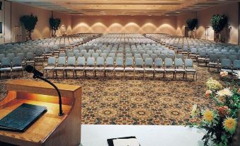 a conference room with rows of chairs and a podium , ready for an event or presentation at Sheraton Philadelphia Downtown