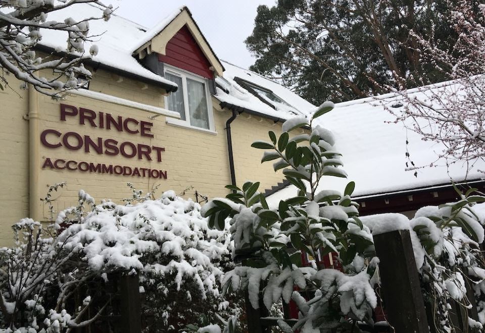 "a snow - covered building with a sign that reads "" prince 's consort accommodation "" prominently displayed on the front" at The Prince Consort