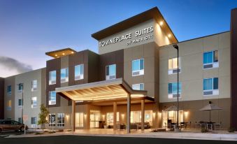 an exterior view of a towneplace suites by marriott hotel , featuring a large sign above the entrance at TownePlace Suites Clovis