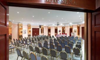 a large conference room filled with chairs arranged in rows , ready for a meeting or event at Splendid Hotel & Spa Nice