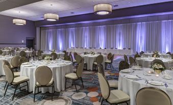 a large banquet hall with multiple tables and chairs set up for a formal event at Sheraton Austin Georgetown Hotel & Conference Center