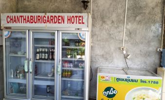 "a refrigerated display case filled with a variety of beverages and snacks , located next to a sign advertising "" kathabujarden hotel .""." at Chanthaburi Garden Hotel