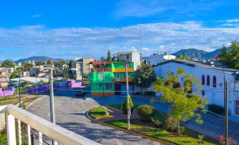 a city park with a variety of play structures , such as slides and swings , for children to enjoy at Villa Del Sol