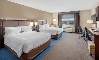 a hotel room with two beds , one on the left and one on the right side of the room at Holiday Inn Owensboro Riverfront