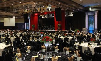 a large banquet hall filled with tables and chairs , ready for a formal event or a formal gathering at Pala Casino Spa and Resort