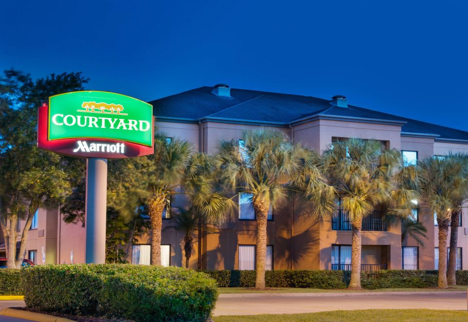 "a large building with a sign that reads "" courtyard marriott "" prominently displayed on the front" at Courtyard Harlingen
