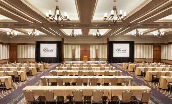 a large conference room with multiple rows of chairs arranged in a semicircle , creating a formal setting at Fairmont Chateau Whistler