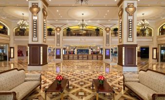 The hotel features a spacious main room with chandeliers and tiled floors in its lobby at Harbourview Hotel