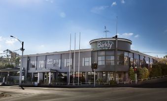 "a large building with the name "" barkley "" on it , surrounded by trees and other buildings" at Barkly Motorlodge
