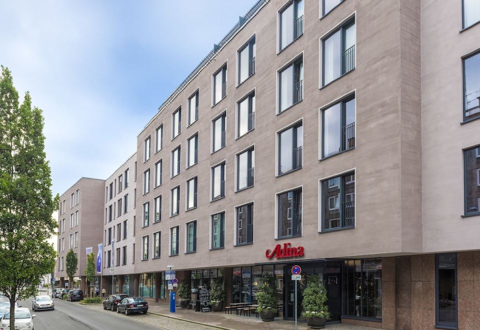 "a building with a sign that says "" b & o "" on it , located in a city street" at Adina Apartment Hotel Nuremberg
