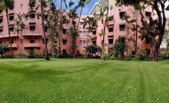 "A large building with trees in front displays the words ""I love you"" on its exterior" at The Royal Hawaiian, A Luxury Collection Resort, Waikiki