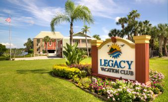 a large sign for the legacy vacation club is displayed in front of a building at Legacy Vacation Resorts-Indian Shores
