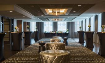 a large room with several rows of stools and tables , creating an inviting atmosphere for guests at Renaissance Allentown Hotel