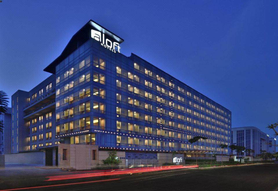 "a large office building at night , with the letters "" eldf "" lit up in blue lights" at Aloft New Delhi Aerocity