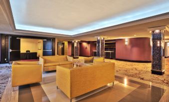 a hotel lobby with various seating options , including couches and chairs , creating a comfortable and inviting atmosphere at Crowne Plaza Kitchener-Waterloo
