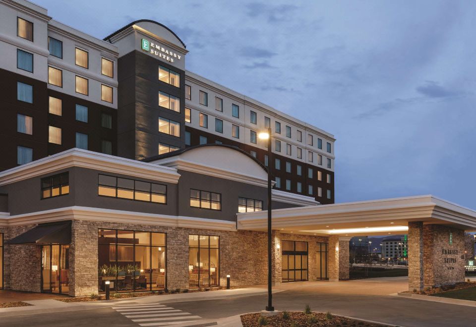 "a modern hotel building with a large entrance and the name "" holiday inn "" on top" at Embassy Suites by Hilton South Jordan Salt Lake City