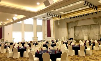 a large banquet hall with white chairs and tables set up for a formal event at Sun Valley Hotel