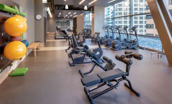 a well - equipped gym with a variety of exercise equipment , including treadmills , stationary bikes , and weight machines at Hyatt Regency Seattle