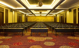a large , empty conference room with rows of chairs arranged in an auditorium - style seating arrangement at Salinda Resort Phu Quoc - Sparkling Wine Breakfast