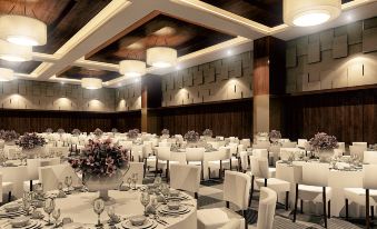 a large , elegant banquet hall with multiple tables set up for a formal event , possibly a wedding reception at Hotel Neo Eltari - Kupang by Aston