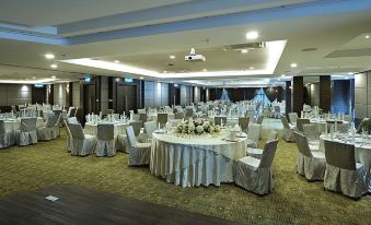 A ballroom has been arranged with tables and chairs for an event at the hotel or conference at Hotel Transit Kuala Lumpur